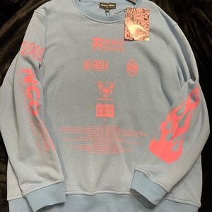 A light blue and pink sweatshirt